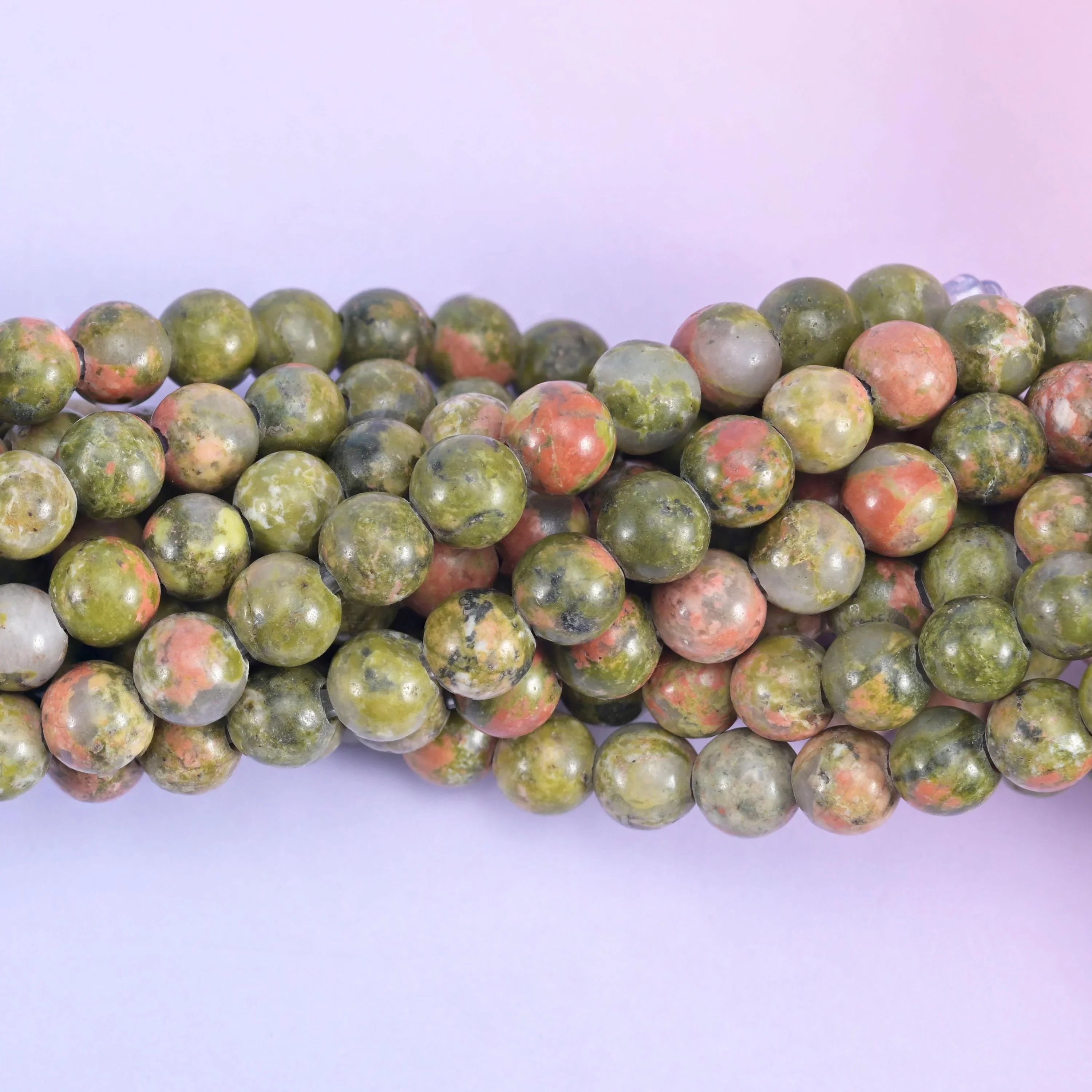 Smooth round cut unakite beads