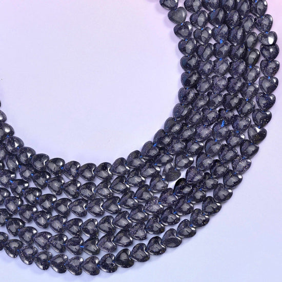 Blue Sandstone (man-made glass) hearts, midnight blue that reads almost black until copper sparkle catches the light