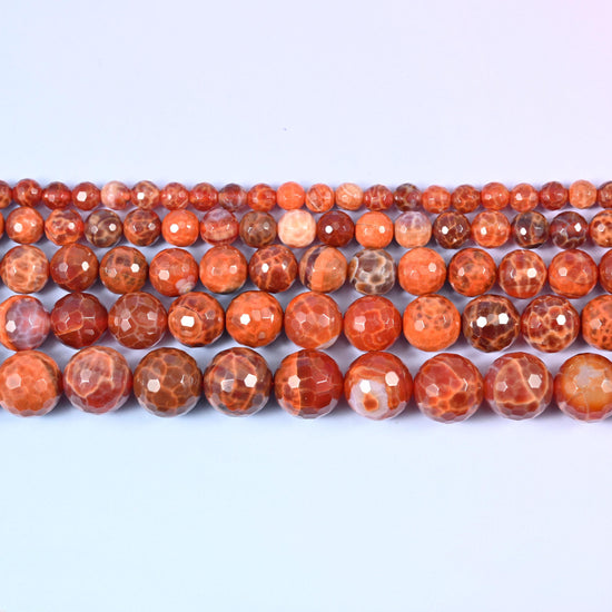 Fire Agate Faceted Round Beads in hot coral-orange with creamy white crackle patterning