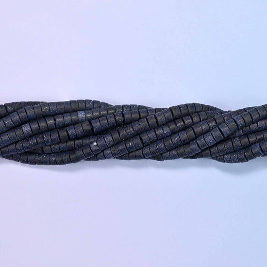 Matte blue sandstone heishi disc beads, approximately 155 per strand