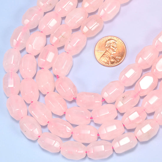 Circular coil of Rose Quartz faceted barrel bead strands on a light background with a penny in the center for size comparison.