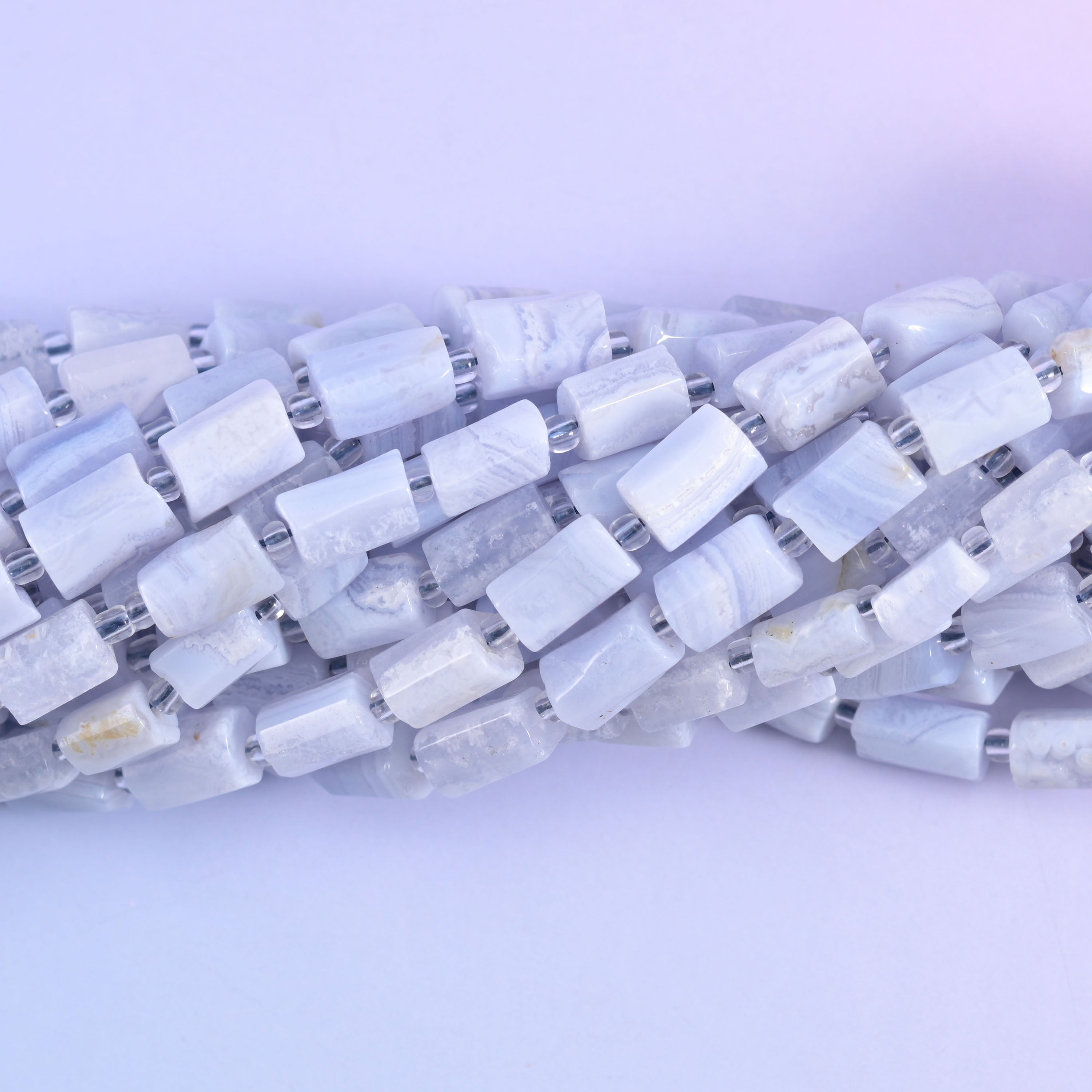 Faceted tube cylinder cut Blue Lace Agate beads for handmade jewelry designs.