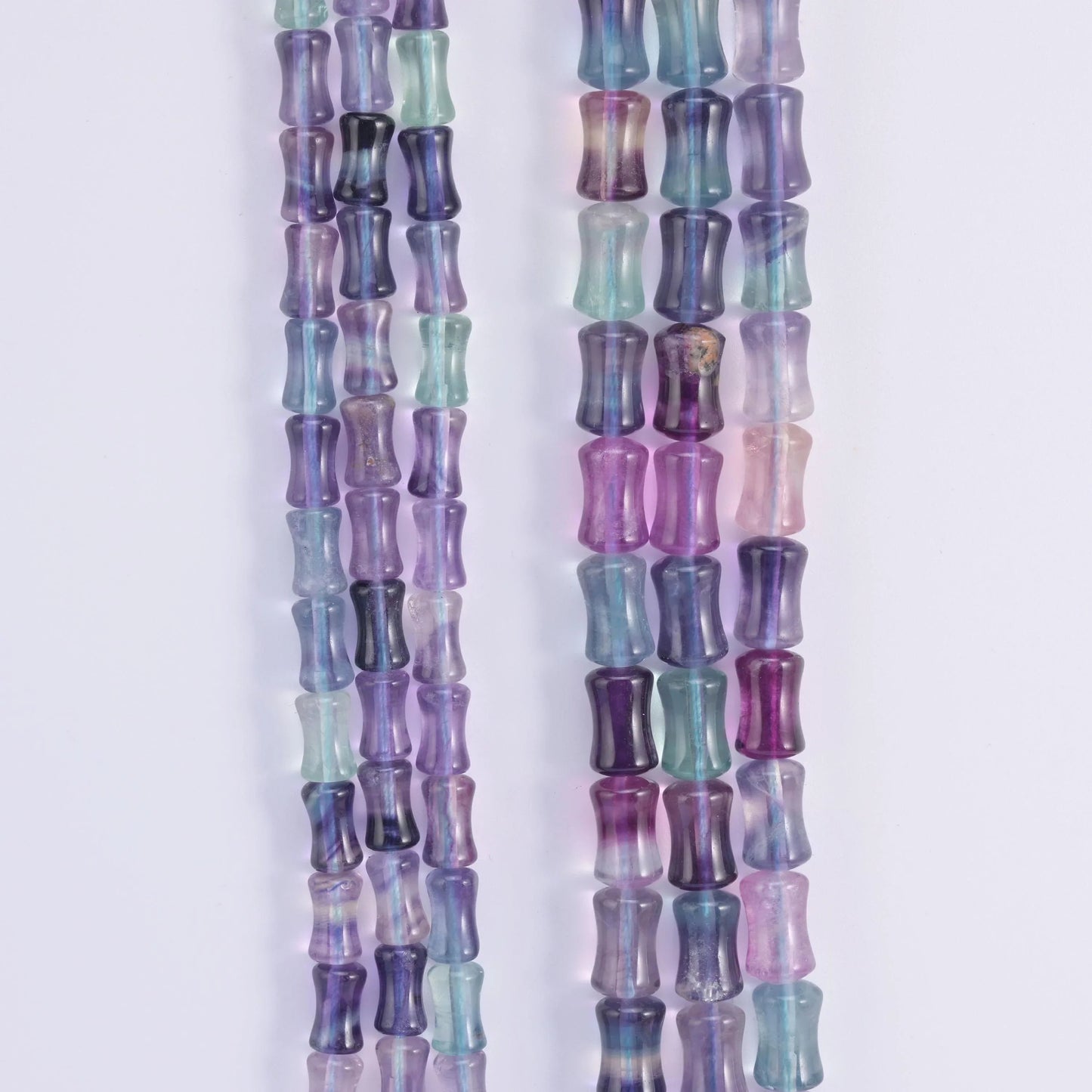 Rainbow Fluorite banded through violet, mint green and teal zones.