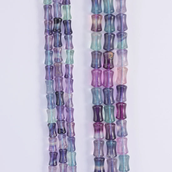 Rainbow Fluorite banded through violet, mint green and teal zones.