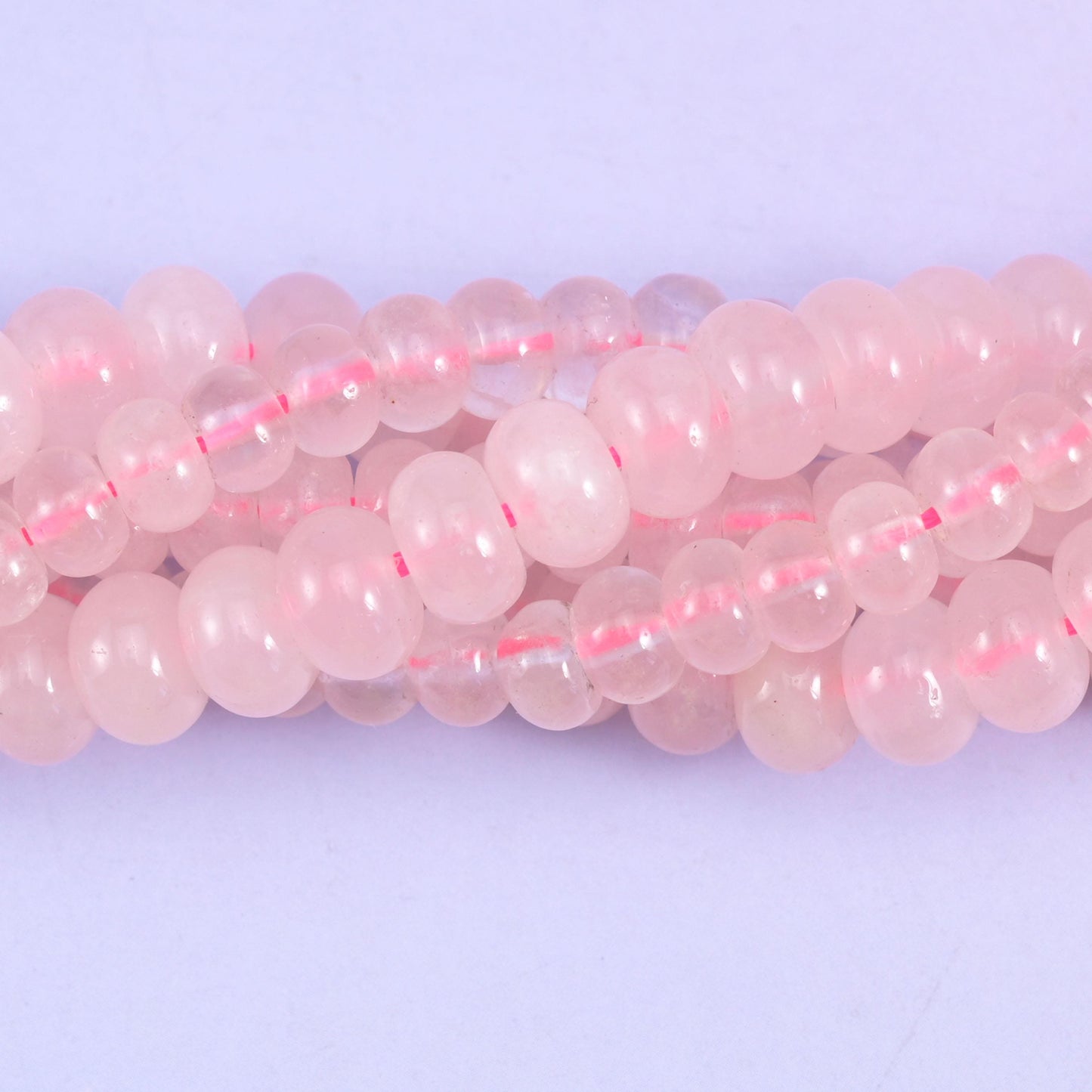 Rondelle cut Rose Quartz beads with a smooth polished finish