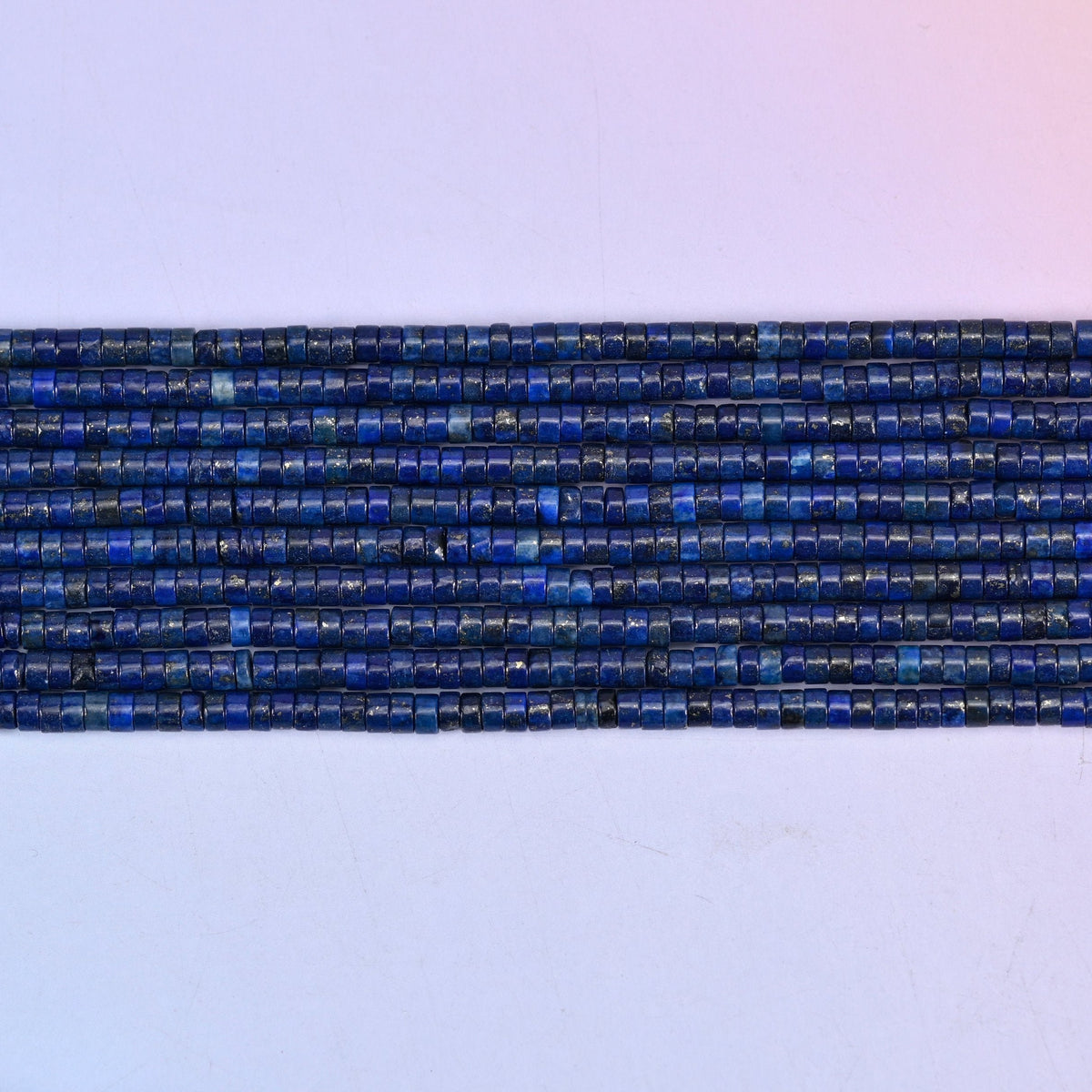 Dark Blue Lapis Smooth Heishi Disc Beads in deep royal blue with golden pyrite flecks