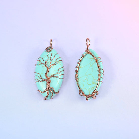 Oval Crystal Pendant with Copper Wired Tree in mint green, front and reverse side by side, the back showing dark veining through the stone.