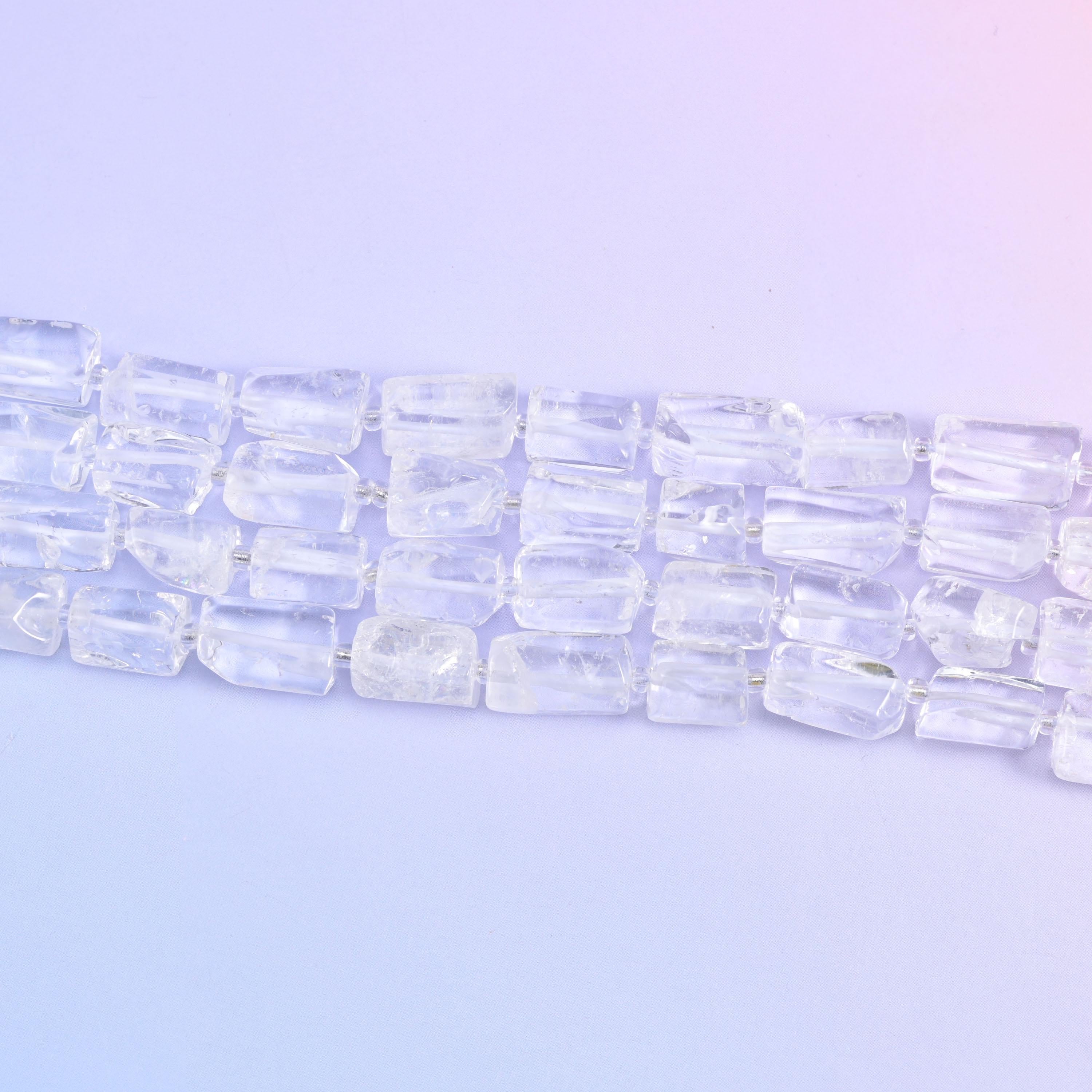 Three strands running diagonally on pale lilac, each tube showing its flat cut faces and internal veils