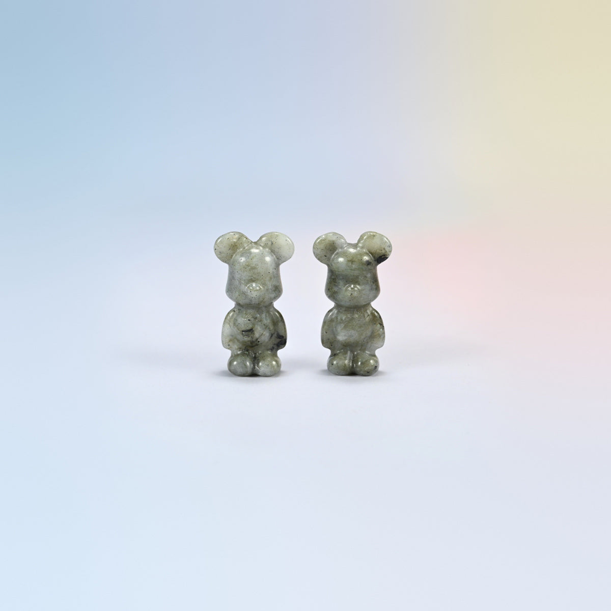 Two 1.5 inch gray labradorite power bear crystal carvings, gray-green natural stone with dark speckles