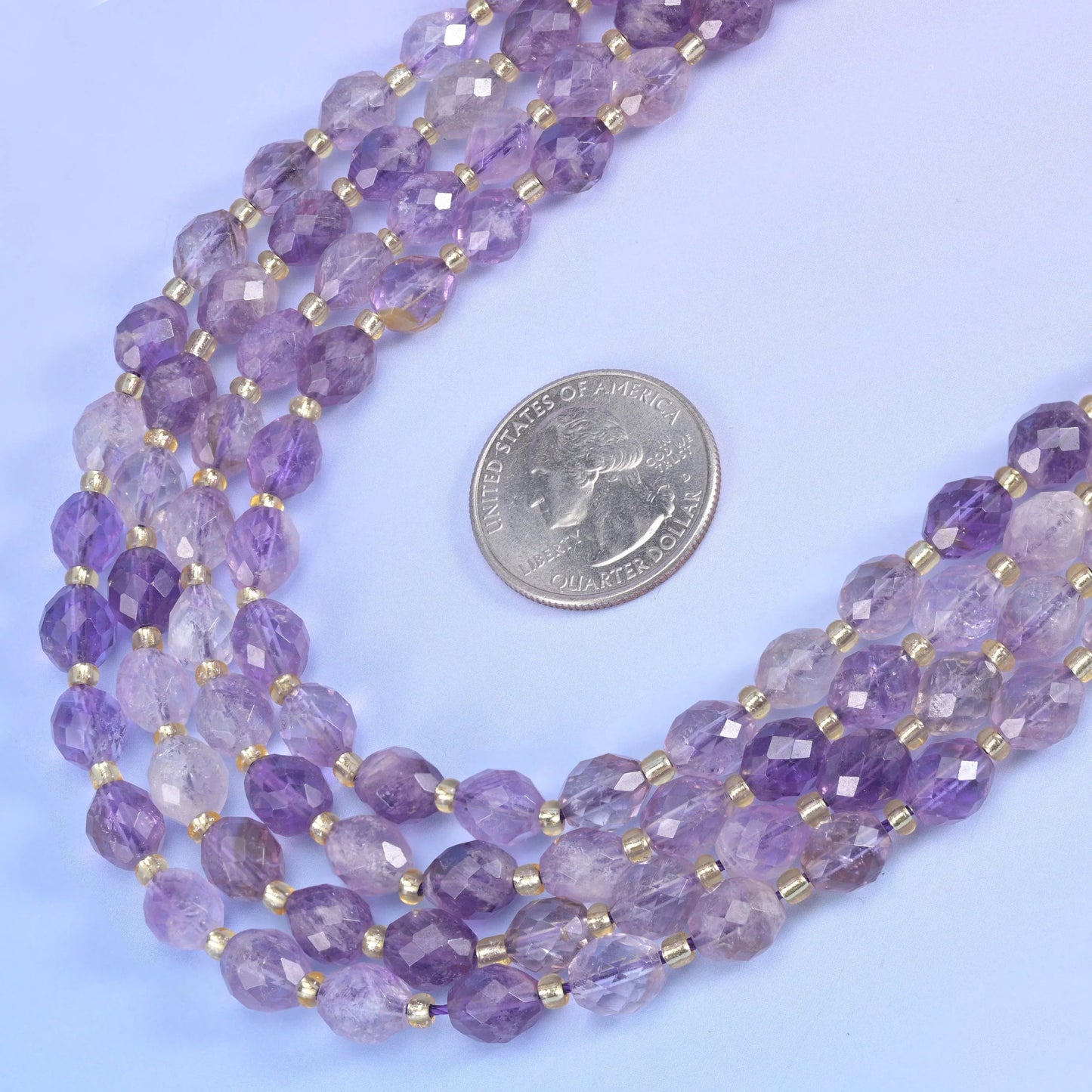 Amethyst rutilated quartz beads in soft violet with golden rutile needles