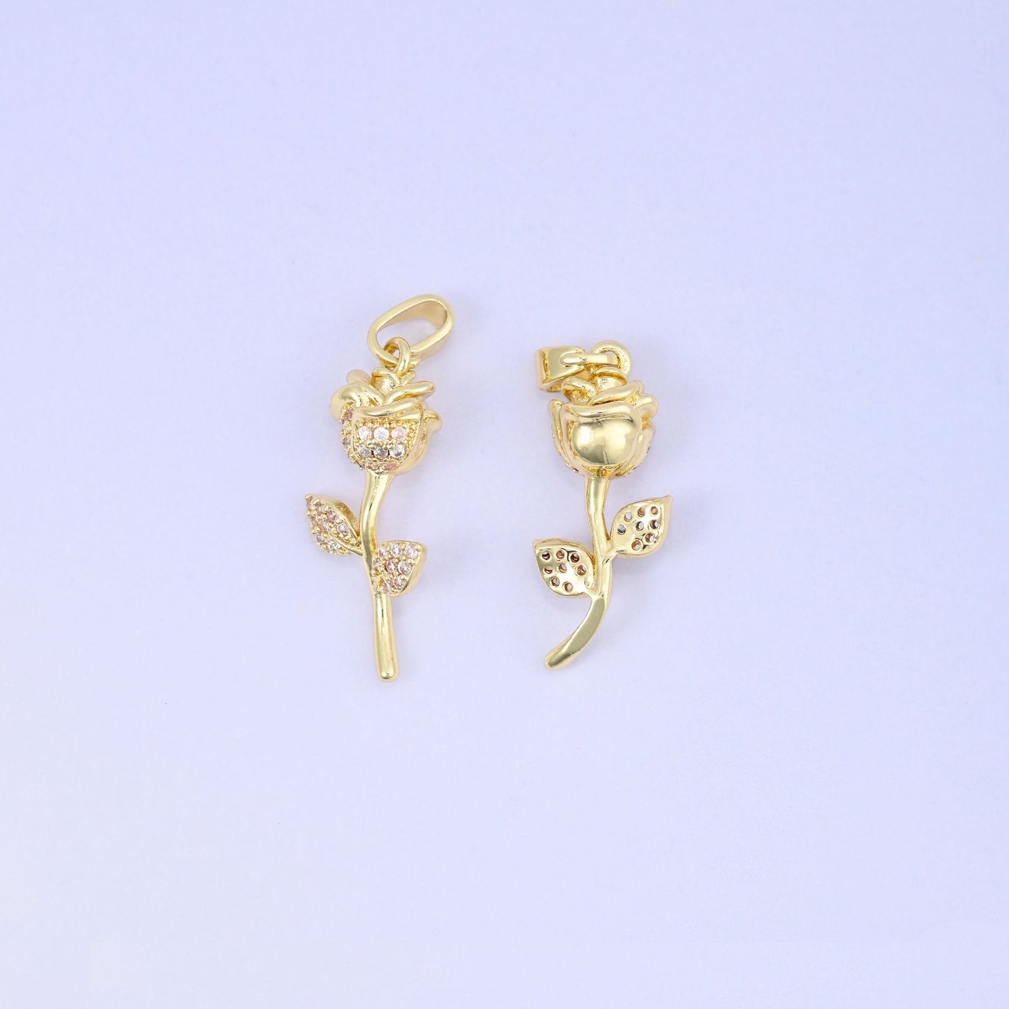 Brass rose and stem charm accented with sparkling clear zircon pave