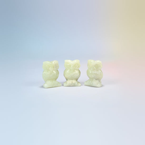Owl crystal carving in new jade, pale yellow-green natural stone