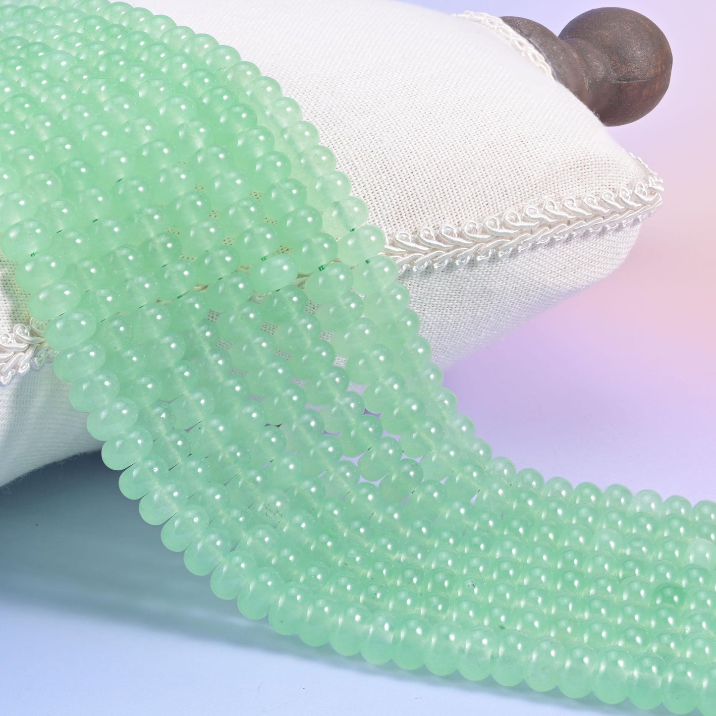 Light Green Dyed Jade smooth rondelle beads in a soft apple green