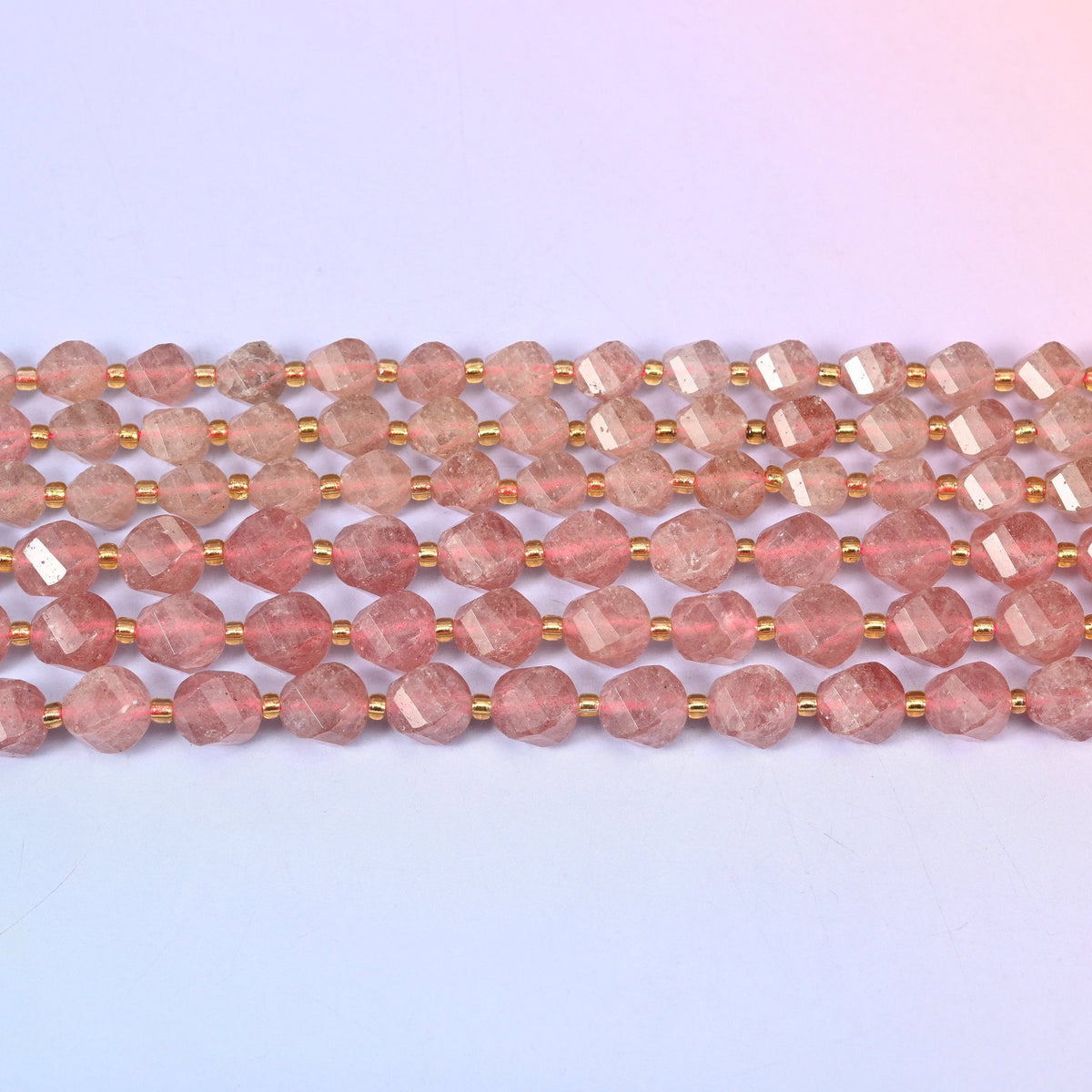 Strawberry Quartz beads in dusty rose flecked with fine silvery-red inclusions
