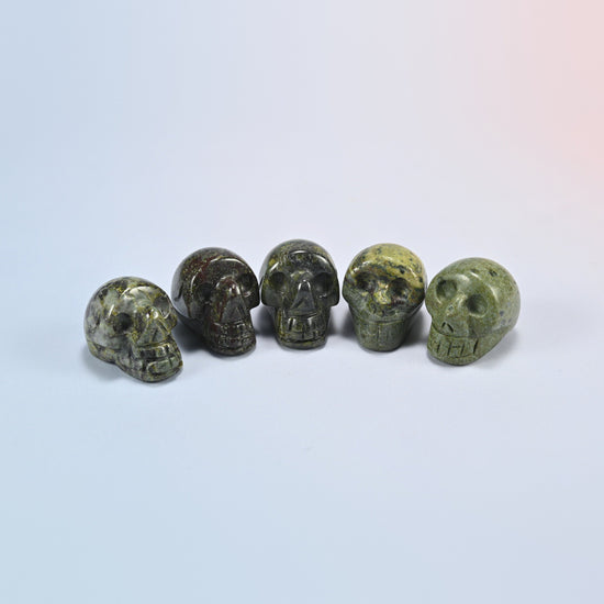 1 inch skull crystal carving in dragon bloodstone, dark green natural stone with red patches