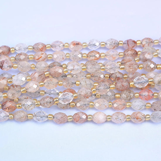 Faceted rice barrel cut red copper rutilated quartz beads