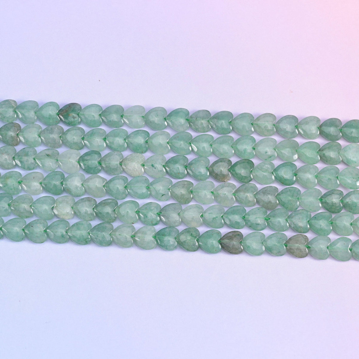 Green aventurine heart beads in soft sage to moss green