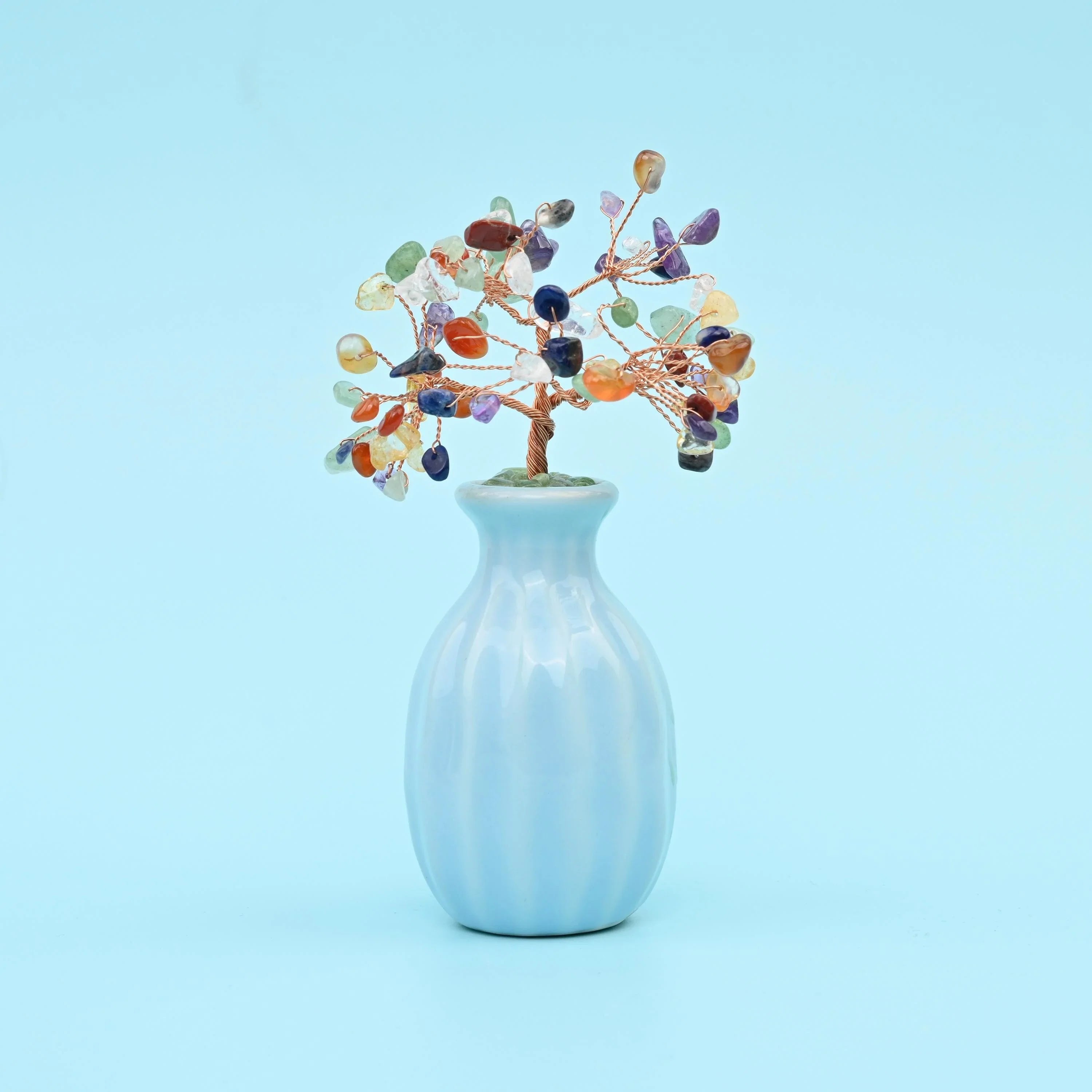 Gemstone Tree in a pale sky-blue ribbed ceramic bud vase.