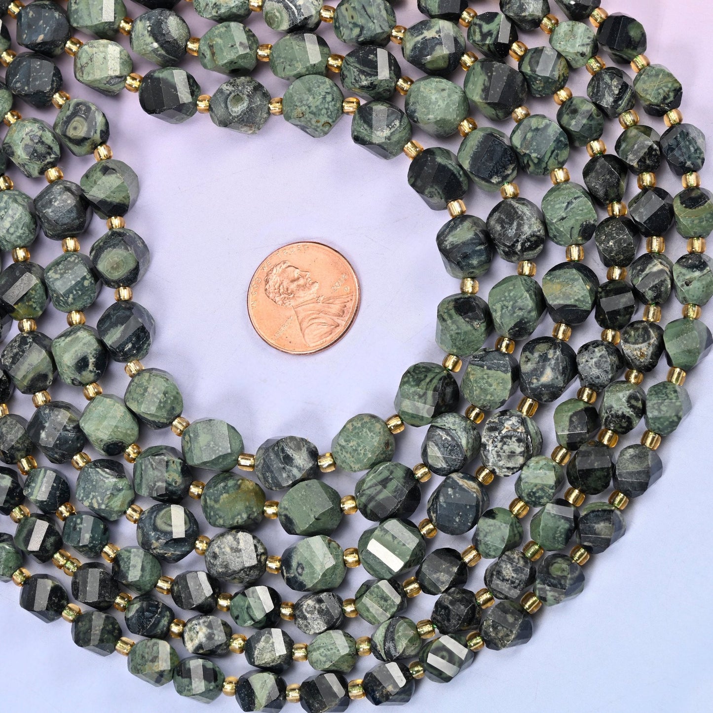Kambaba Jasper Faceted Spiral Twist Beads, deep forest and moss green patterned with black orbicular rings and swirling eyes
