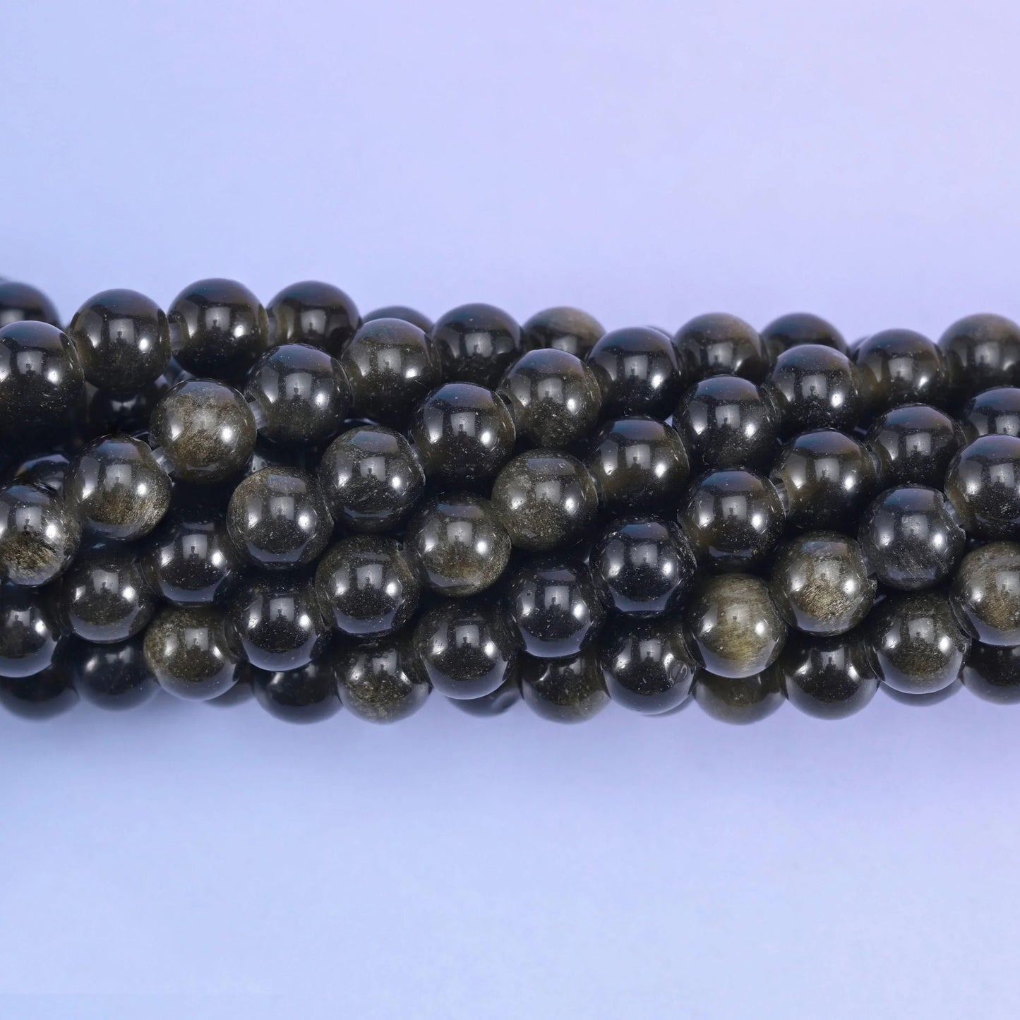 Smooth round cut gold obsidian beads