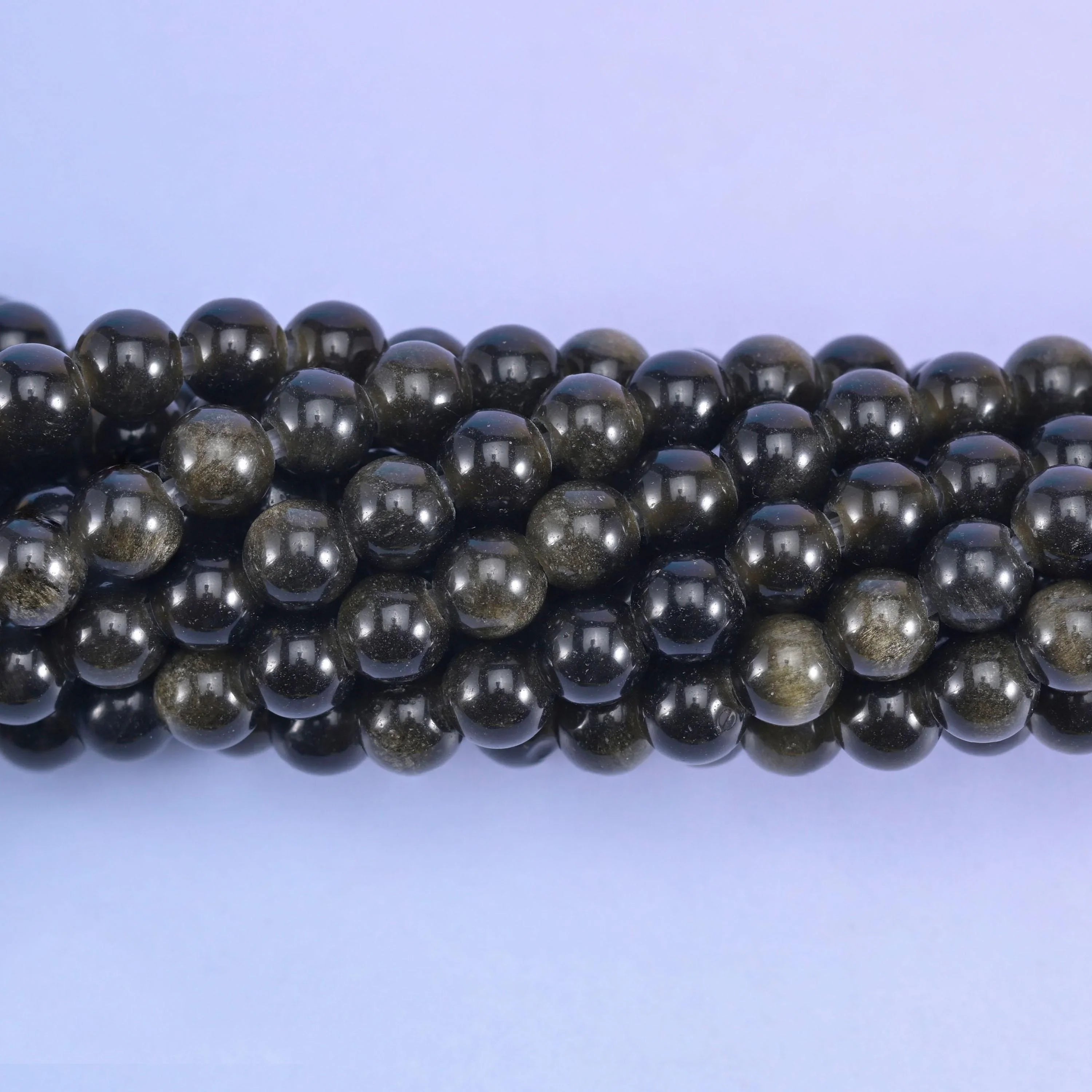 Smooth round cut gold obsidian beads