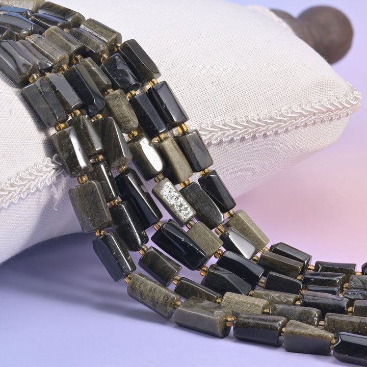 Natural Gold Obsidian faceted tube beads with a striking golden, mirror-like sheen.