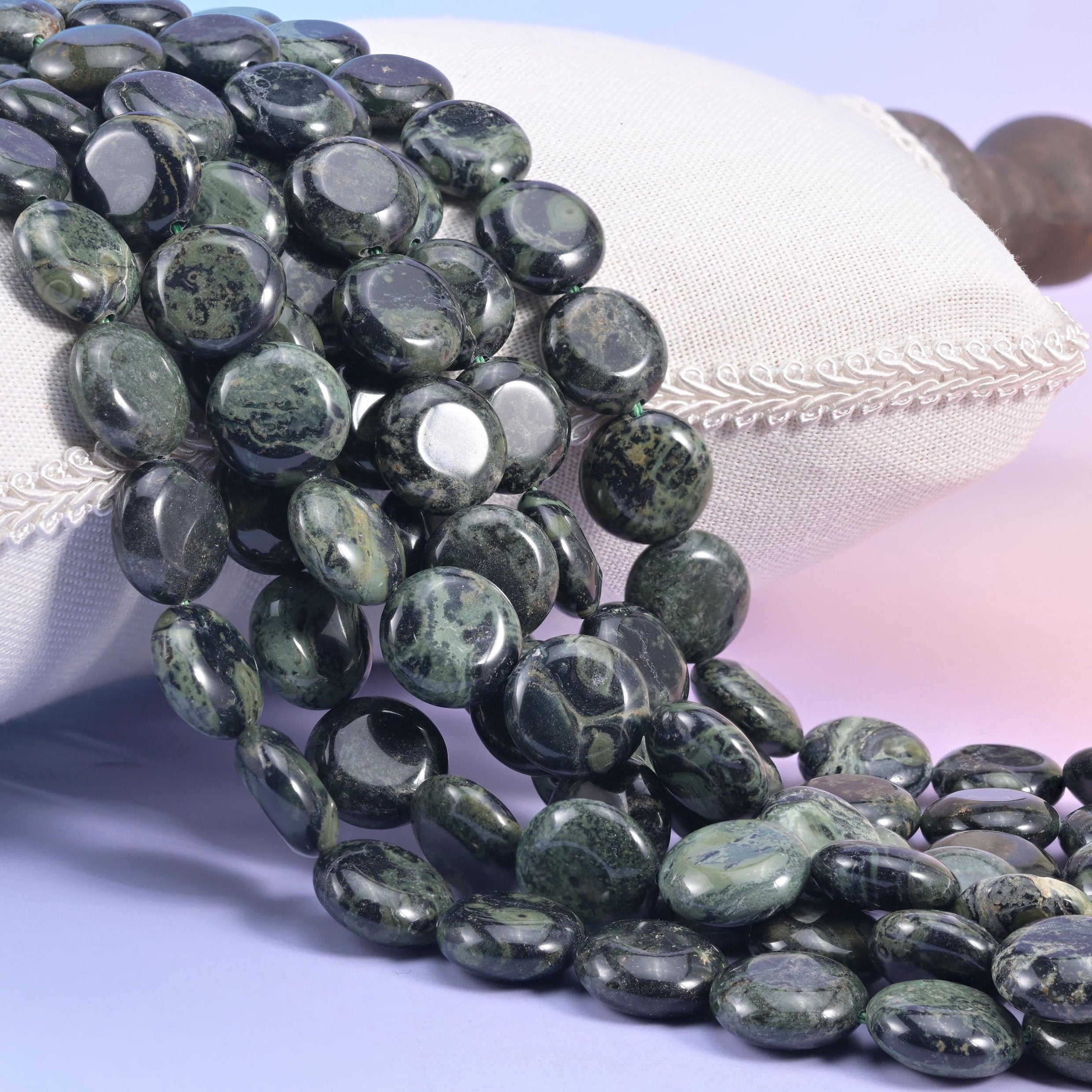 Natural Kambaba Jasper smooth coin beads in near-black with mossy sage green orbs