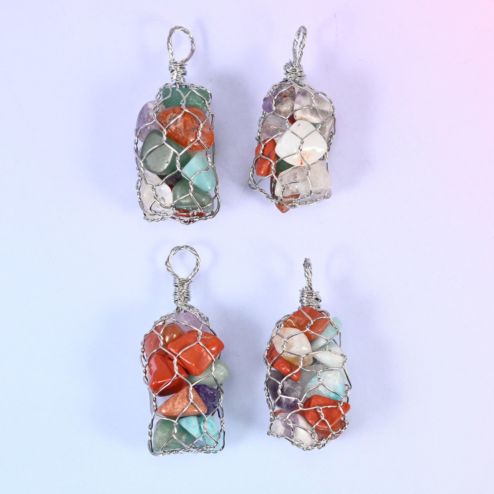 Wire Wrapped Cage Gemstone Chip Pendant, a fine wire net worked into a rounded cylinder packed with tumbled gemstone chips