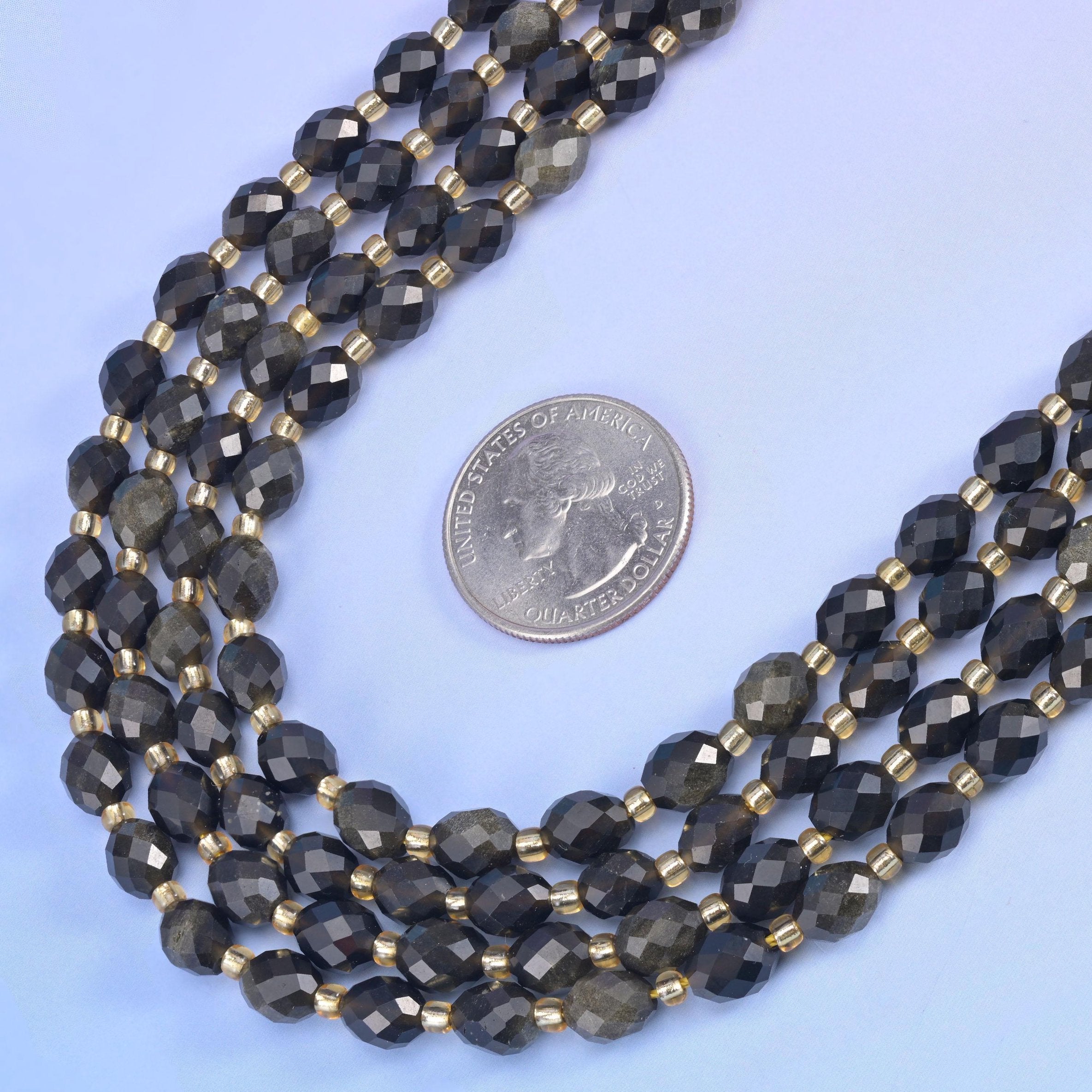 Gold Obsidian Faceted Rice Barrel Beads in near-black with a bronze-gold sheen