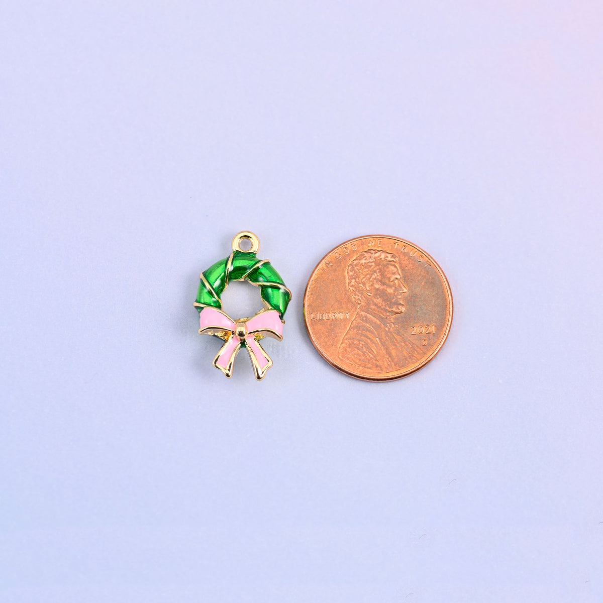 Green wreath charm shown at actual size, 19.54 x 12.49mm.