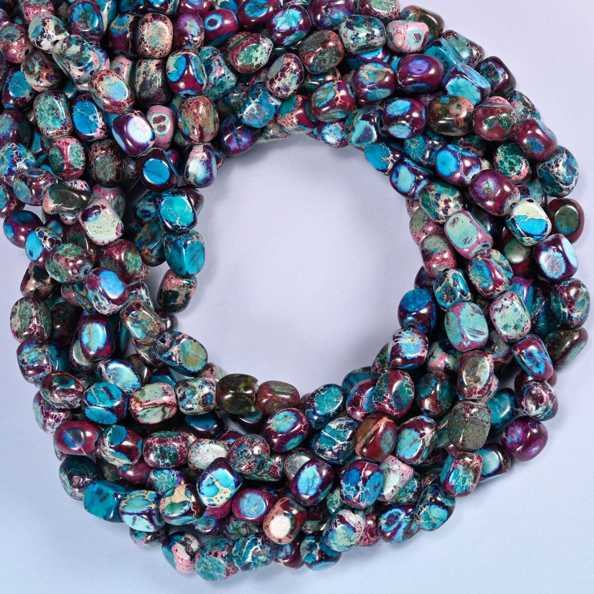 Purple Dyed Sea Sediment Jasper, natural veining and turquoise patches differ on every nugget.