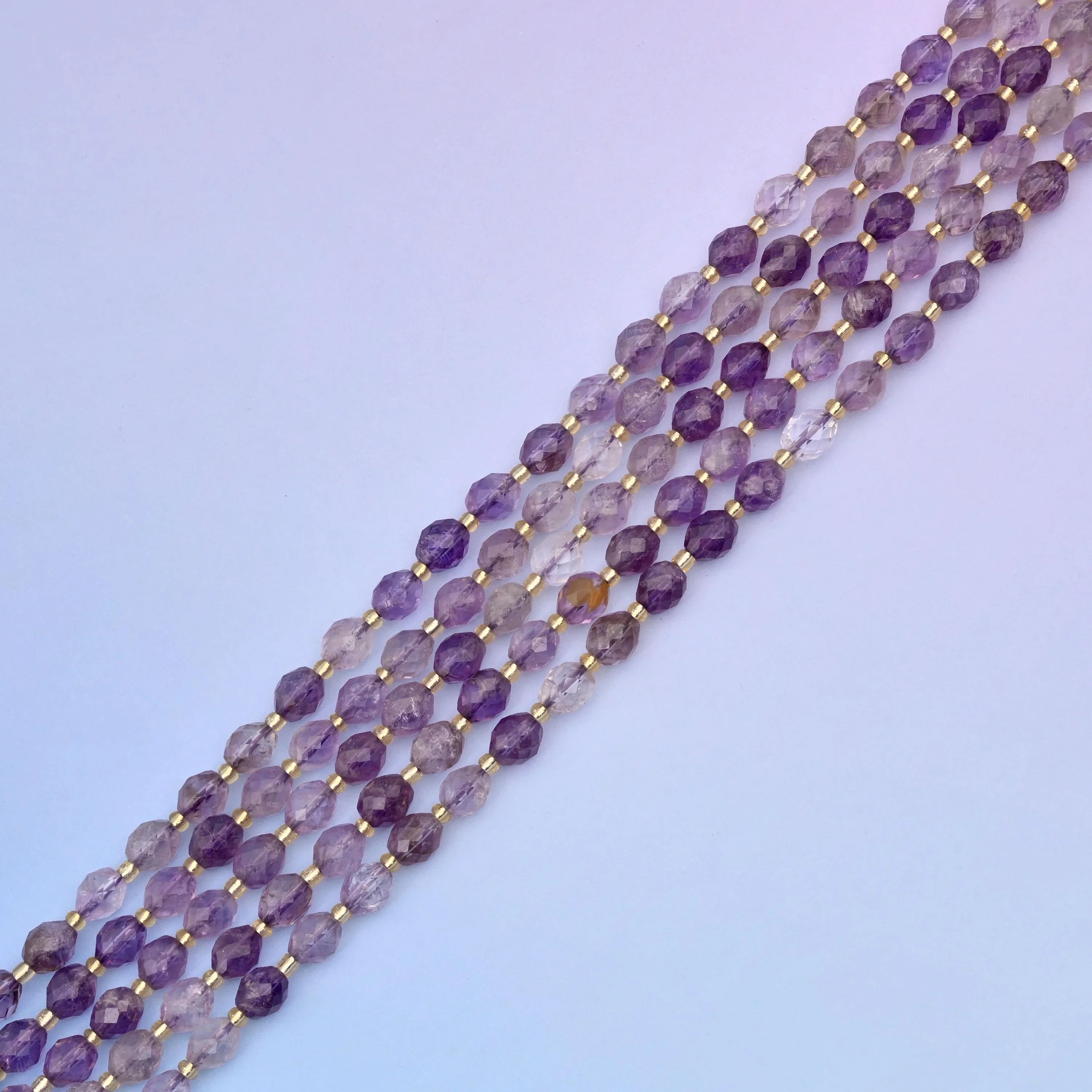 Amethyst rutilated quartz beads, approximately 39 beads per strand