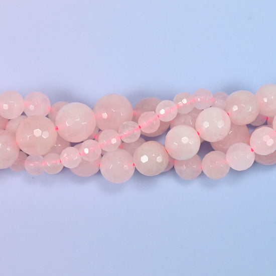 End detail of a pink rose quartz beaded strand (15-inch strand), showing bead spacing.