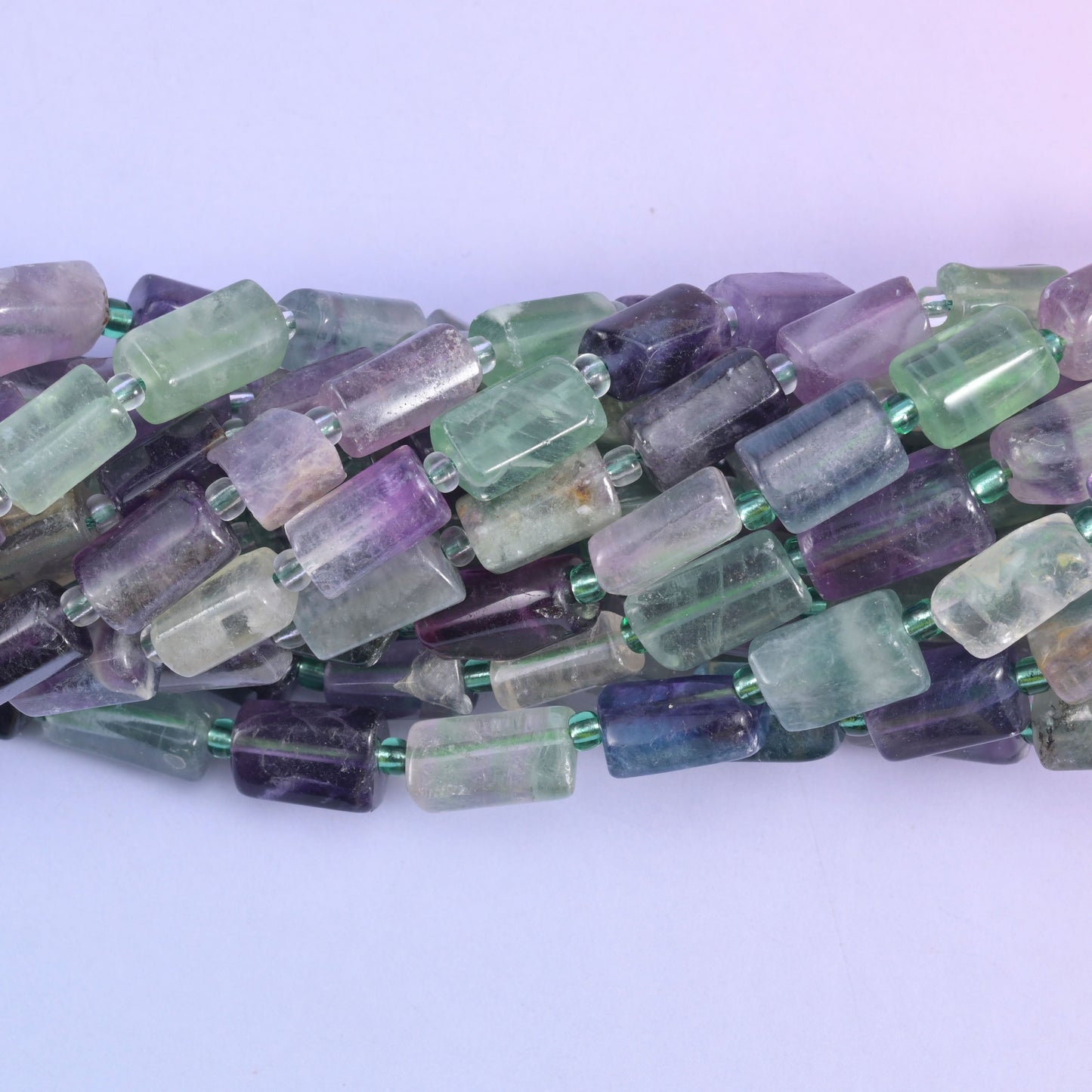 Faceted tube cut fluorite beads.