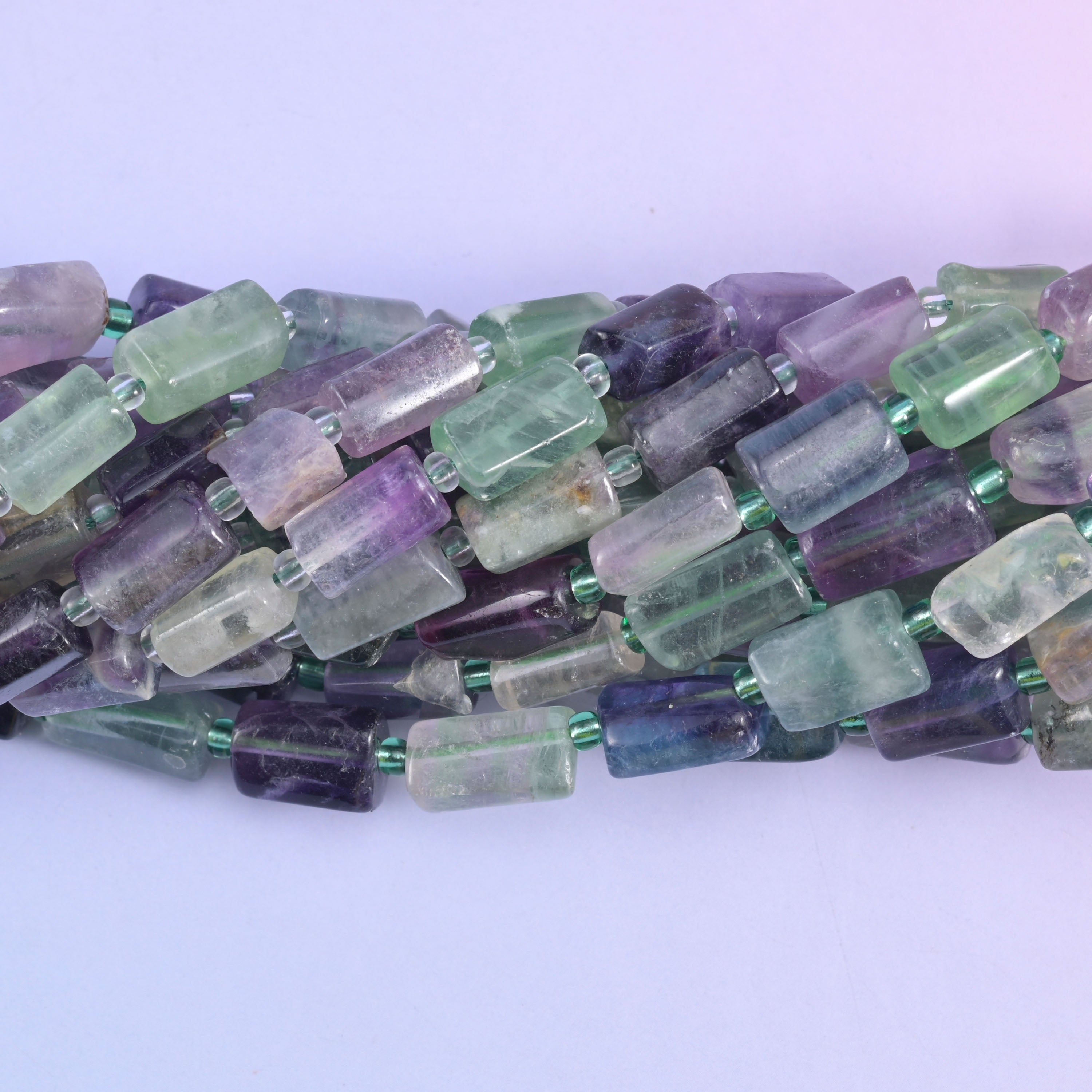 Faceted tube cut fluorite beads.
