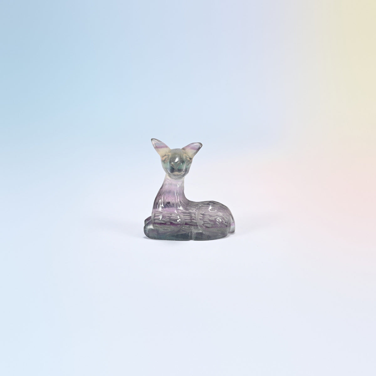 Natural rainbow fluorite deer carving, 2 inch, purple and clear banding