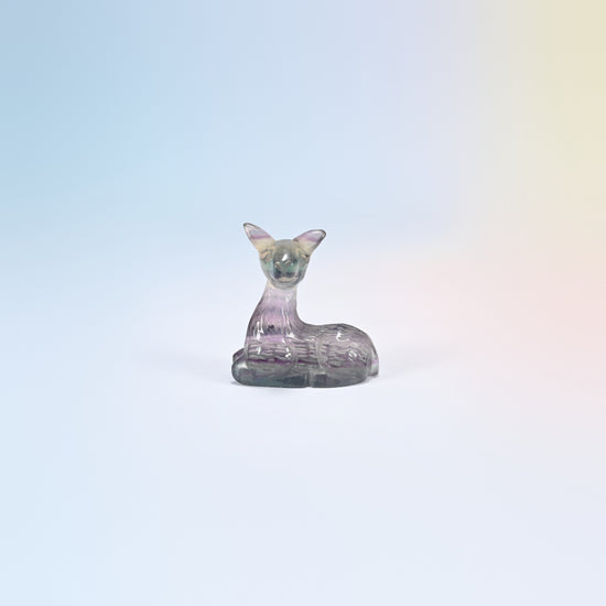 Natural rainbow fluorite deer carving, 2 inch, purple and clear banding