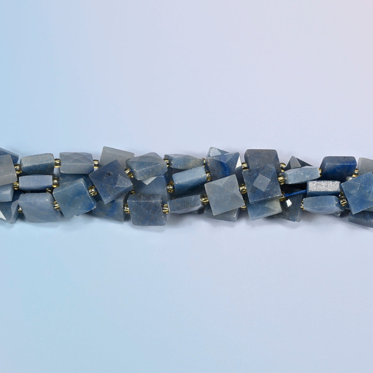 Strands of natural blue aventurine faceted flat square beads twisted together in a horizontal row