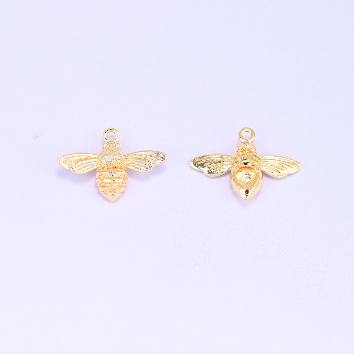Small gold charms bee, two charms side by side showing the front and back of the 18K gold plated bee