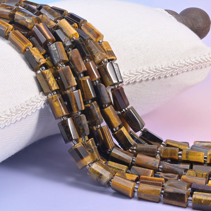 Tiger Eye faceted tube beads with rich golden-brown bands and a silky shimmer.