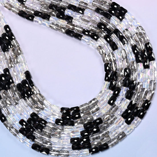 Black gray clear faceted rectangle glass beads shaped into a tall teardrop, strands layered inside.