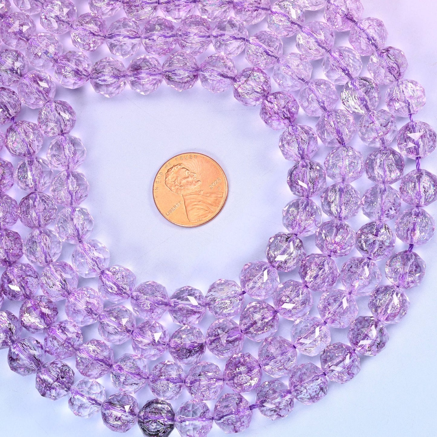 Transparent purple faceted round glass beads, approximately 42 beads per strand