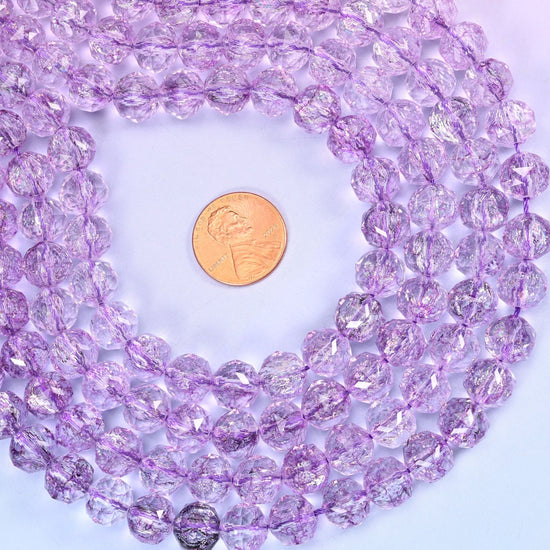 Transparent purple faceted round glass beads, approximately 42 beads per strand