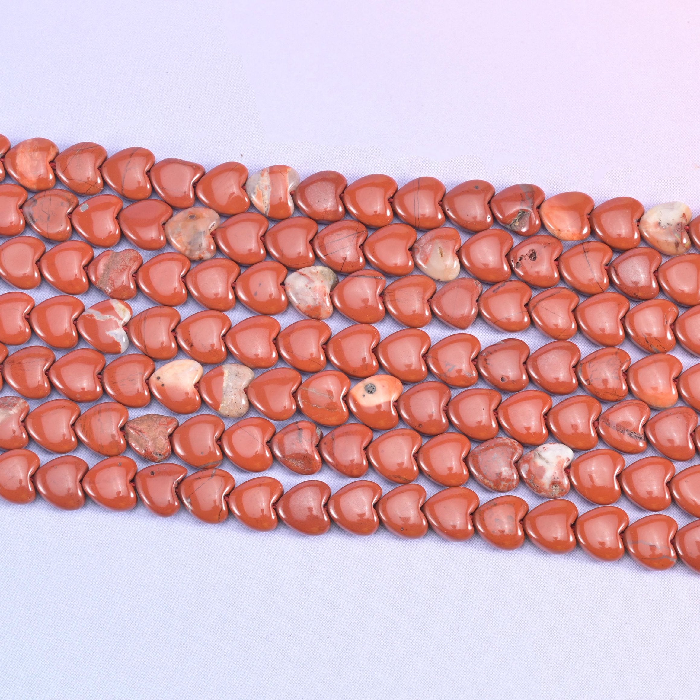 Red jasper heart beads in deep brick red