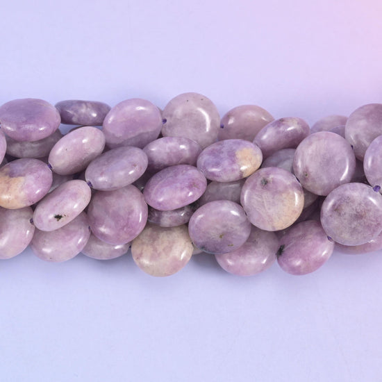 Coin cut Lepidolite beads with a quiet satin polish