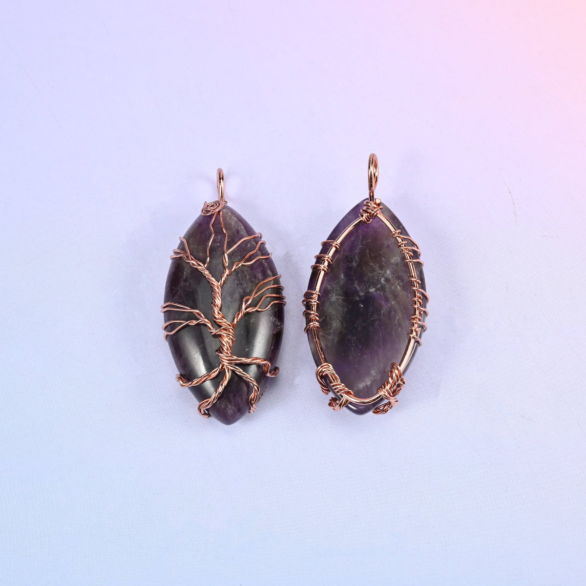 Oval Crystal Pendant with Copper Wired Tree in purple, front view beside the reverse so the wrapped bail and edge wiring can be compared.