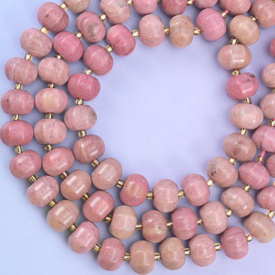 Pink rhodonite pumpkin beads, approximately 35 beads per strand