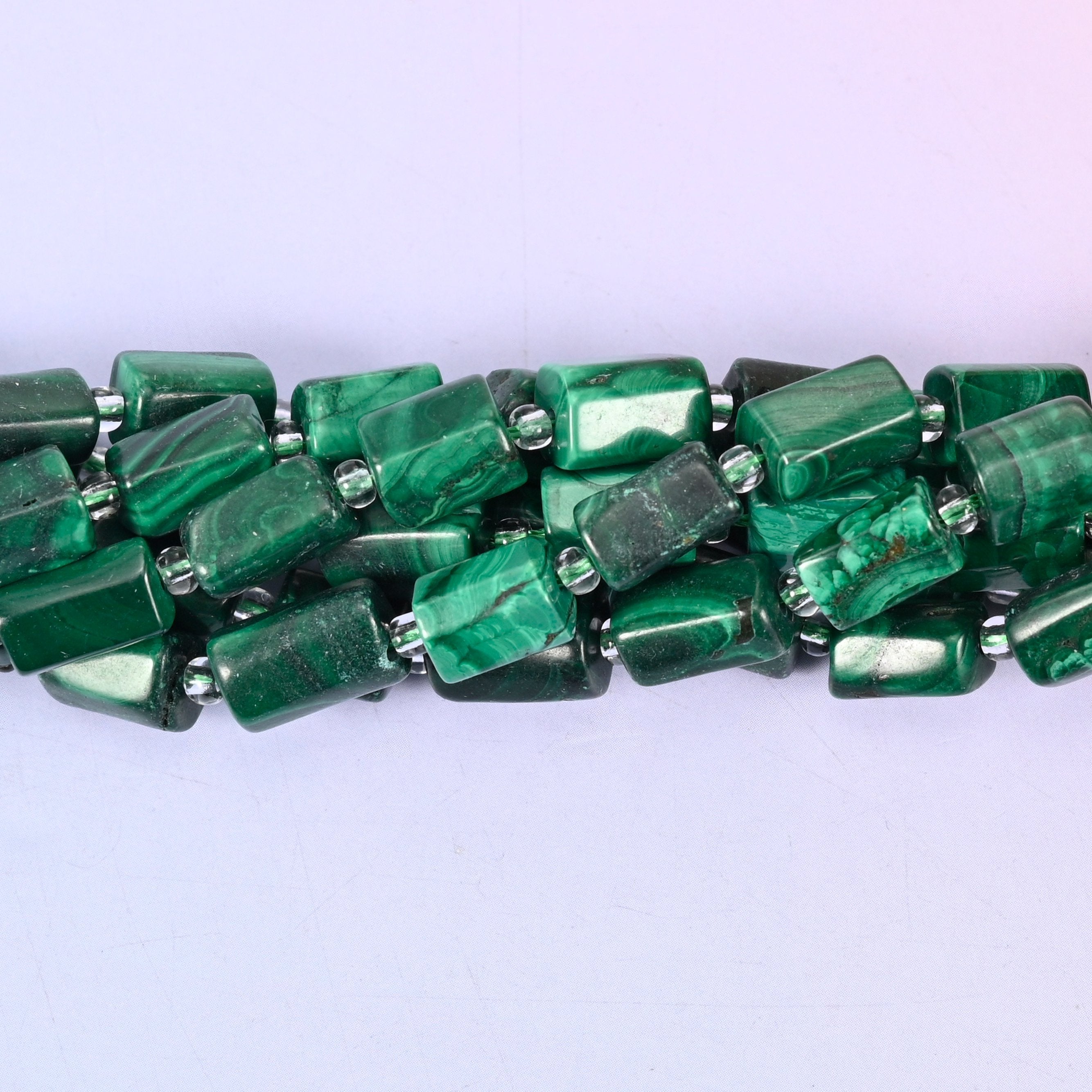 Natural Malachite faceted tube beads — a sleek, contemporary cylinder shape with rich green banding, perfect for handmade jewelry designs.