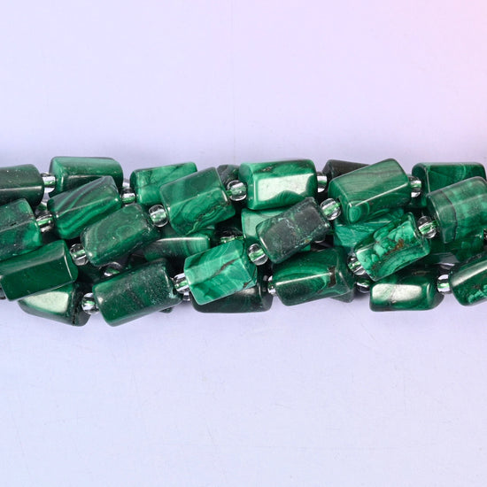 Natural Malachite faceted tube beads — a sleek, contemporary cylinder shape with rich green banding, perfect for handmade jewelry designs.