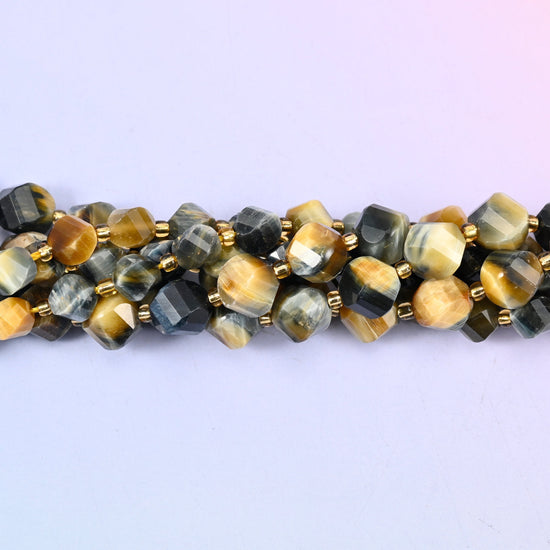 Dream Tiger Eye Faceted Spiral Twist Beads, honey and butterscotch gold banded against steely blue-grey and near-black